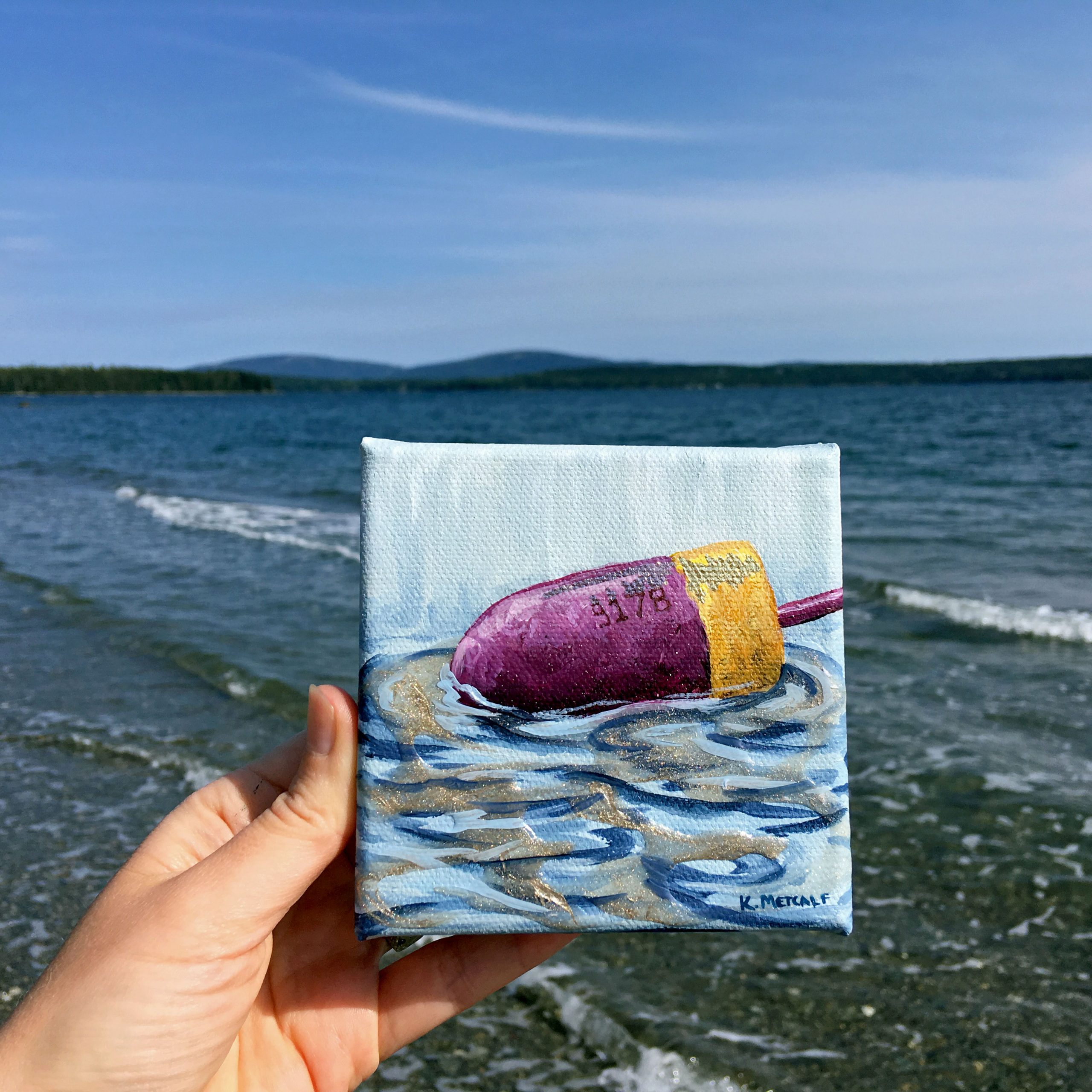yellow-purple-buoy-by-water